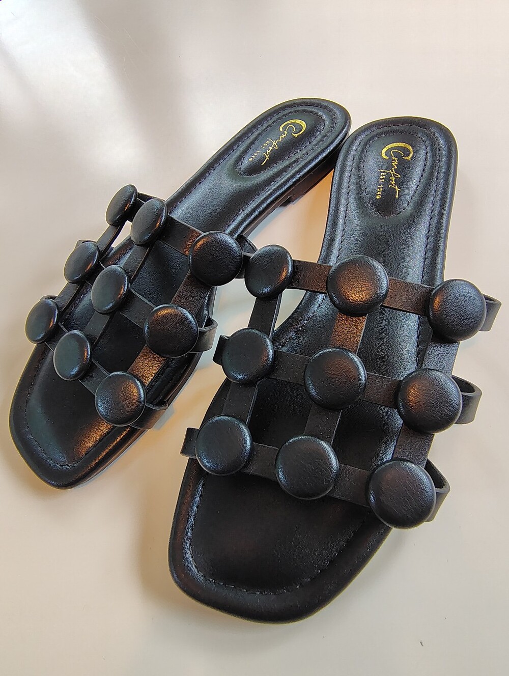 Comfort black flat sandals with button details